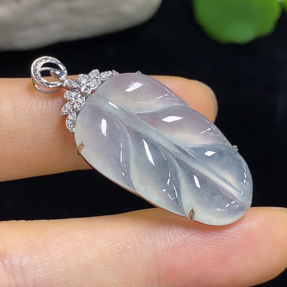 Jadeite leaf pendant on 18k necklace with diamond accents, weighing approximately 4.5g, by HKHQ.