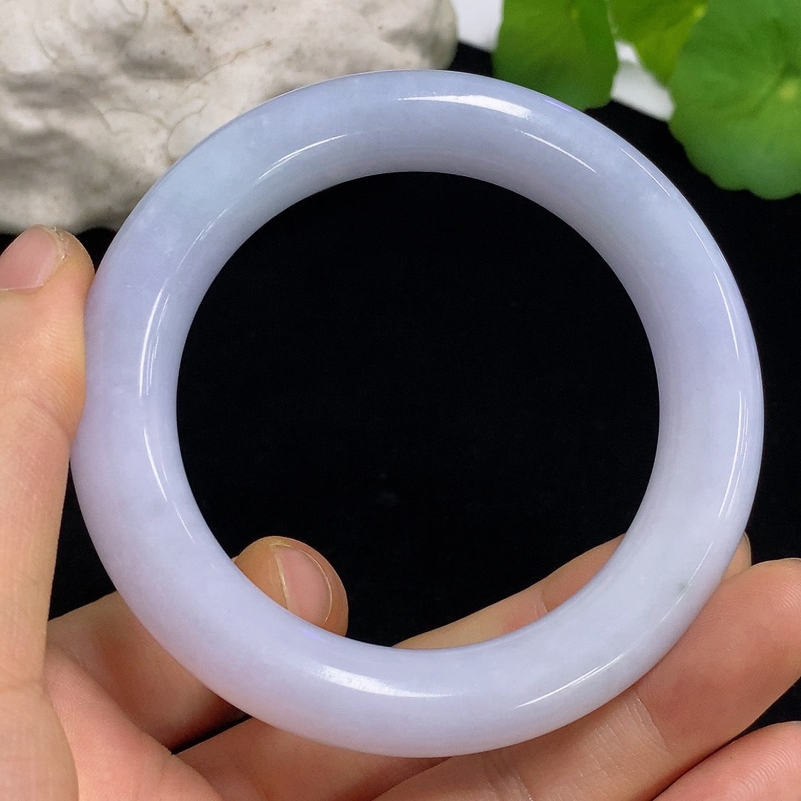 HKHQ jadeite round bangle in size 54.5 with a smooth, polished surface and natural green color, weighing 71.4 grams.