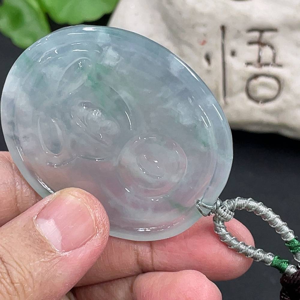 Huiliu Jadeite Guanyin pendant featuring intricate carved design, certified jadeite material, and elegant religious motif.