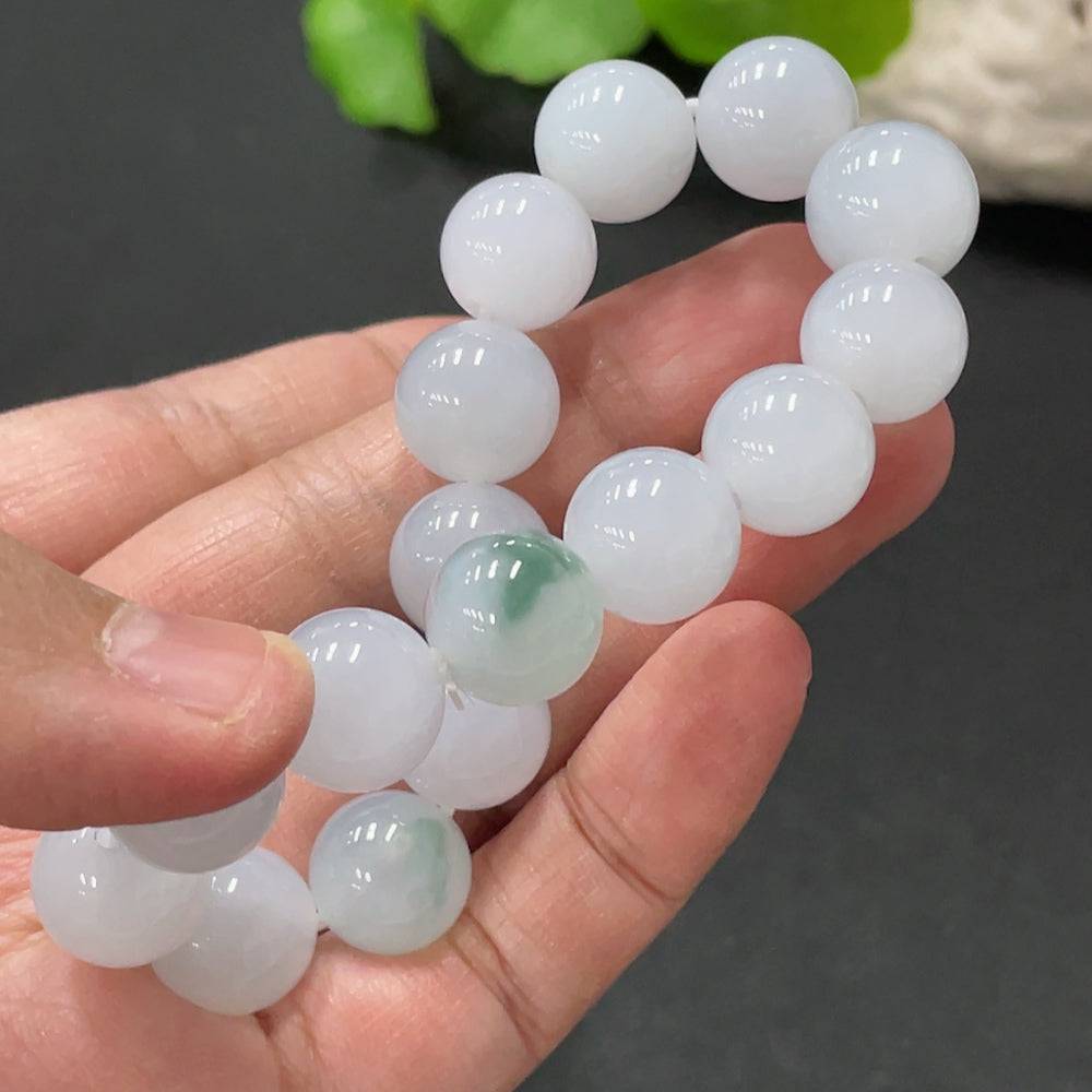 Huiliu Jadeite bracelet with 12.4mm smooth jade beads, certified by Huiliu, showcasing elegant green jade jewelry.