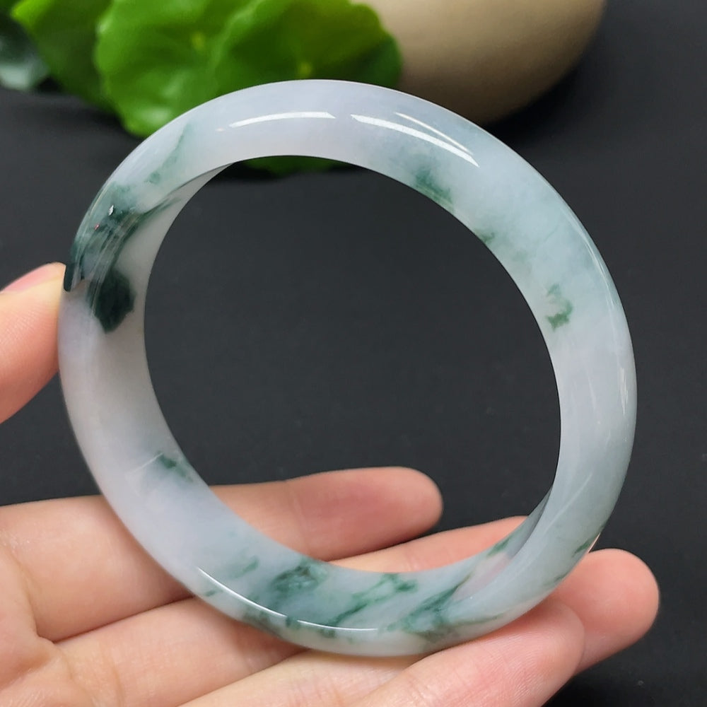 HKHQ jadeite round bangle with mineral components, weight 54.31g, size 57.9, showcasing smooth polished surface and natural green hues.