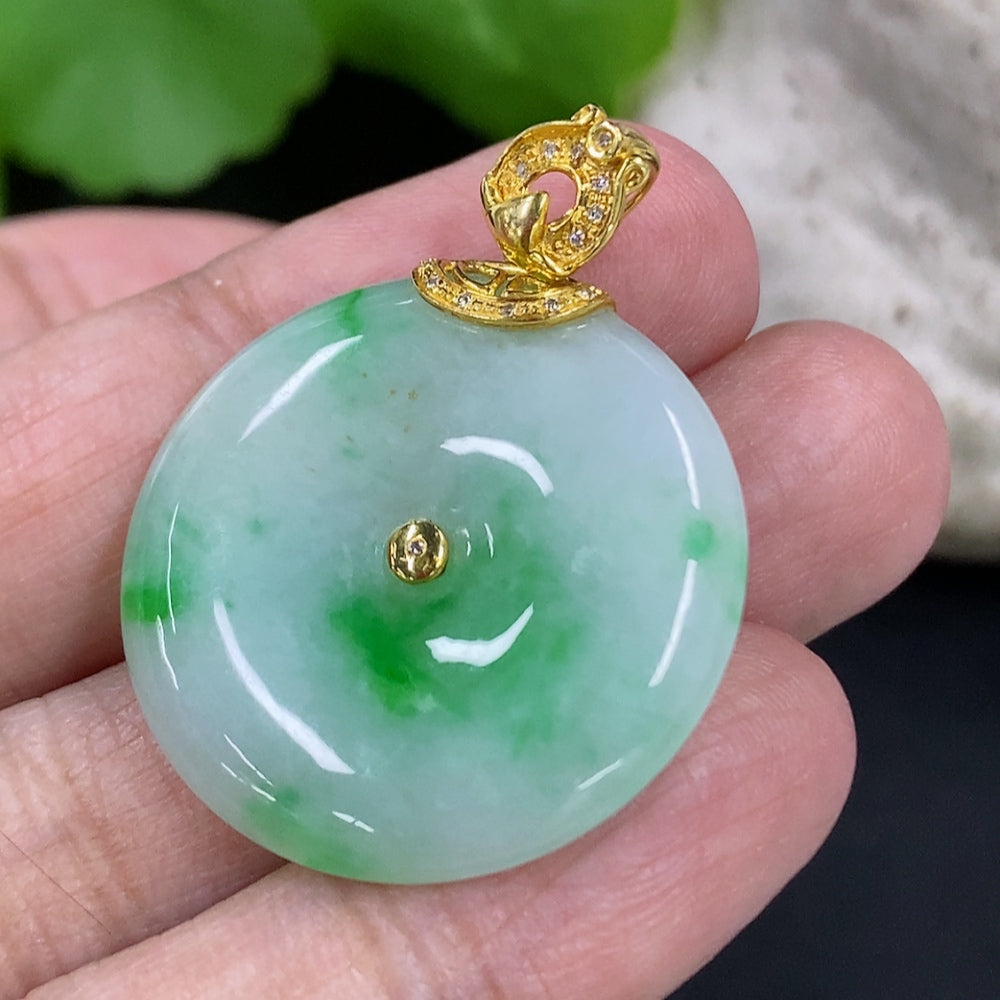 Jadeite peace knot pendant with 18K gold clasp and diamond accents, weighing approximately 8.55g, from HKHQ.