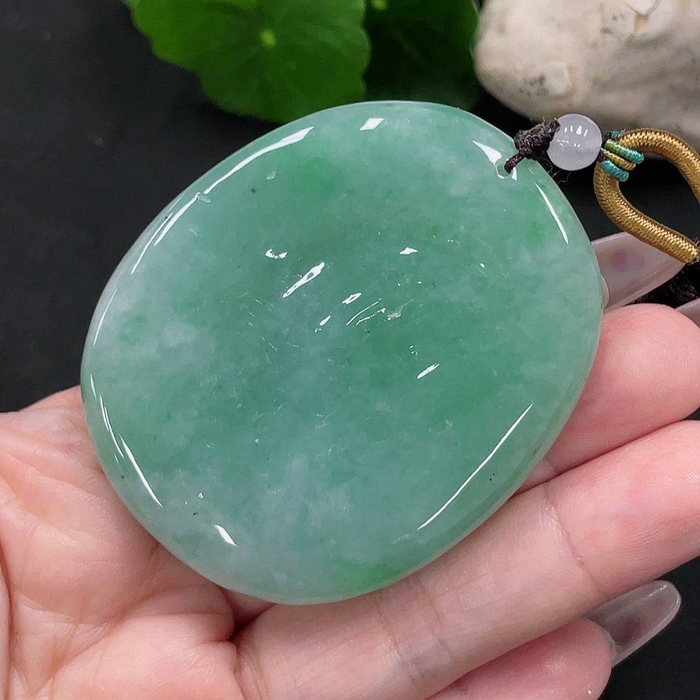 Huiliu Jadeite Phoenix and Peony pendant showcasing detailed craftsmanship and vibrant green jadeite craftsmanship.
