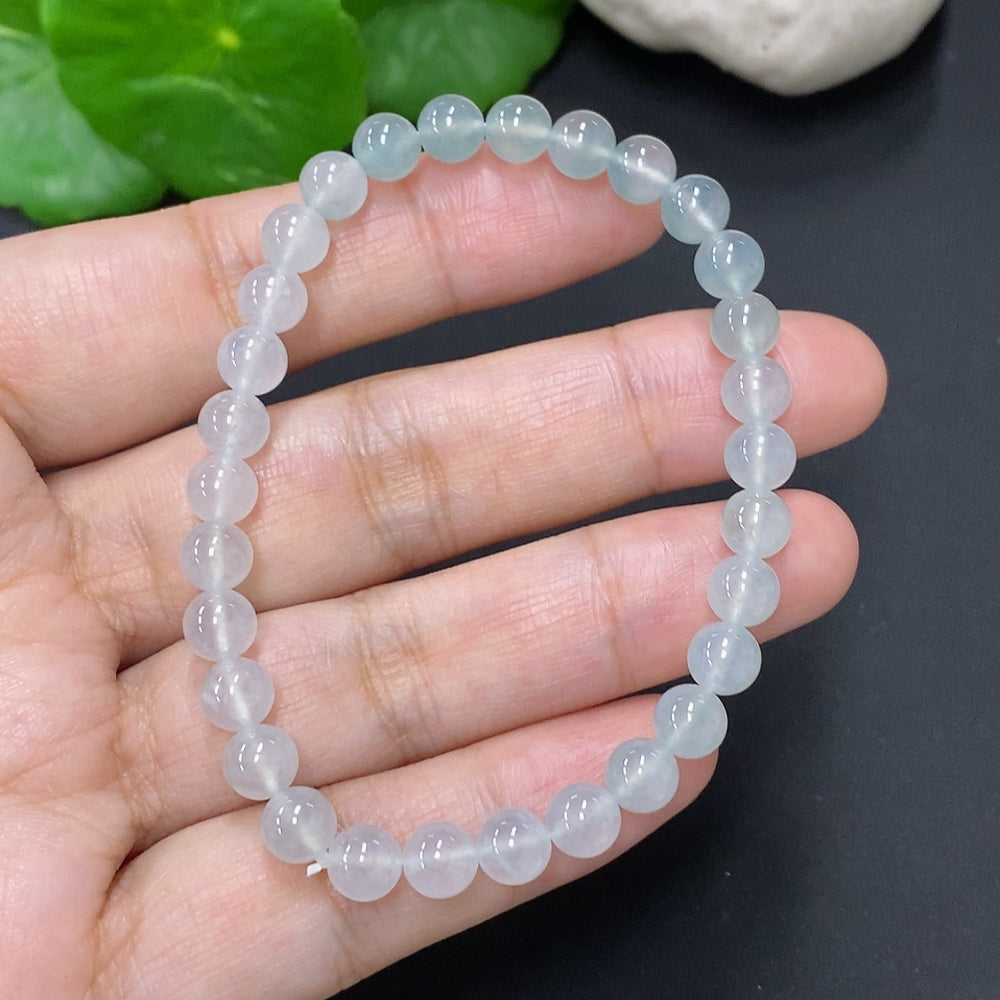 Jadeite bead necklace with 5.8mm beads, showing smooth, polished green jade beads on a string, HUILIU HQ jewelry.