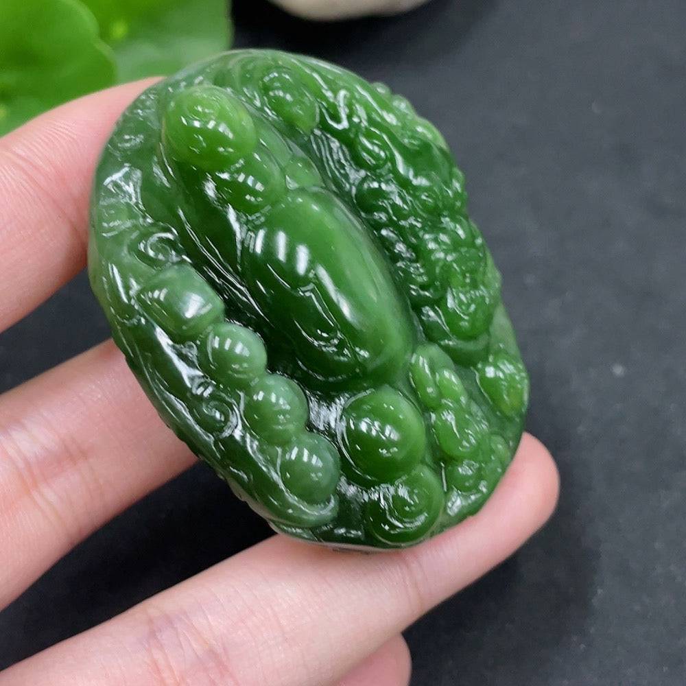 Huiliu Hetian jade pendant featuring a dragon design, intricately carved and polished, showcasing traditional craftsmanship.