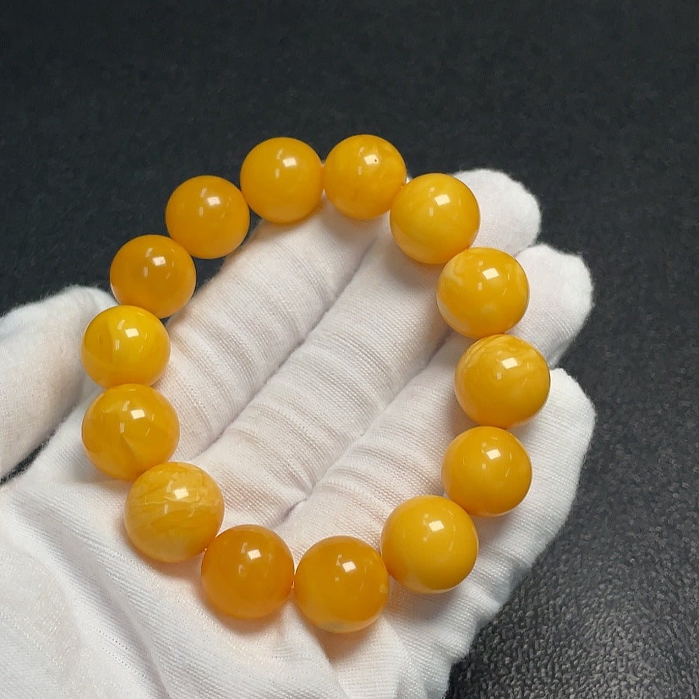 Amber Beeswax Bracelet by HUILIU HQ featuring 14.5mm amber beads, natural honey-colored beeswax design.