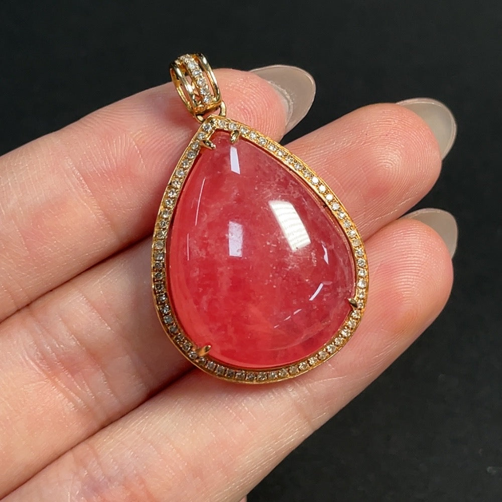 Rhodochrosite pendant with 18K gold and diamond accents, showcasing organic matter and weighing approximately 10.53g.