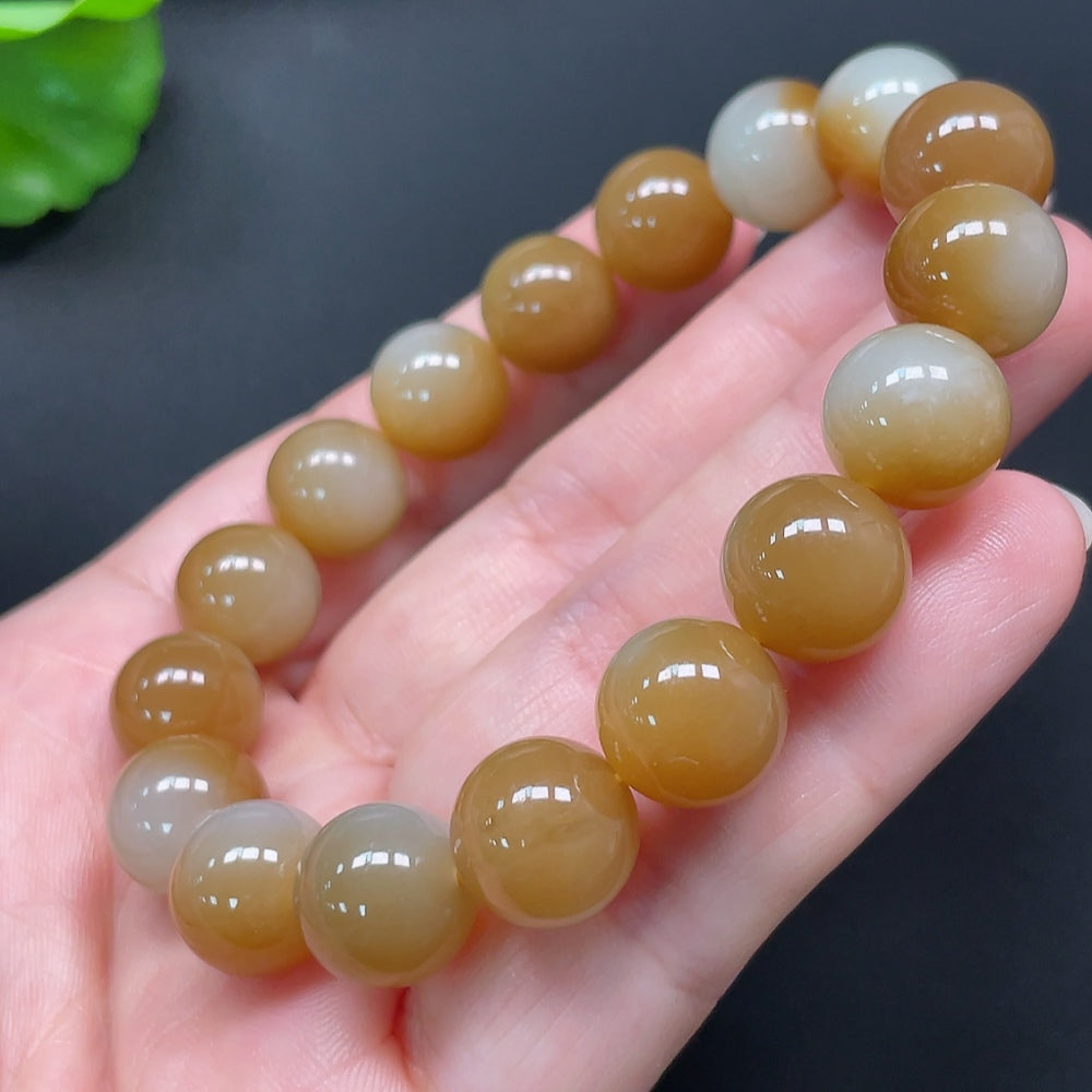 Hetian jade bracelet with 11.9mm beads, weighing approximately 44.96g, crafted by HKHQ, featuring smooth, polished jade stones.