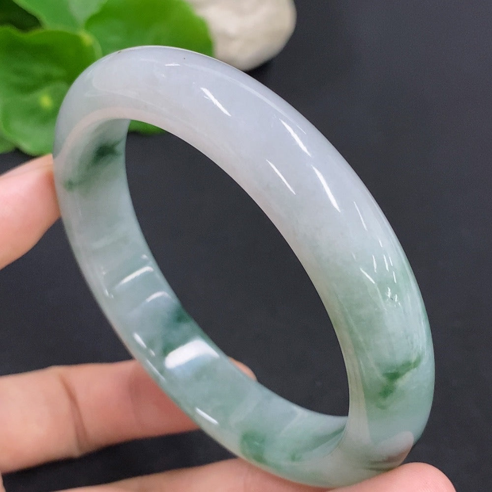 Jadeite round bangle with a smooth finish, weighing approximately 65.6g, size 60, from HKHQ, showcasing its vibrant green jade color.