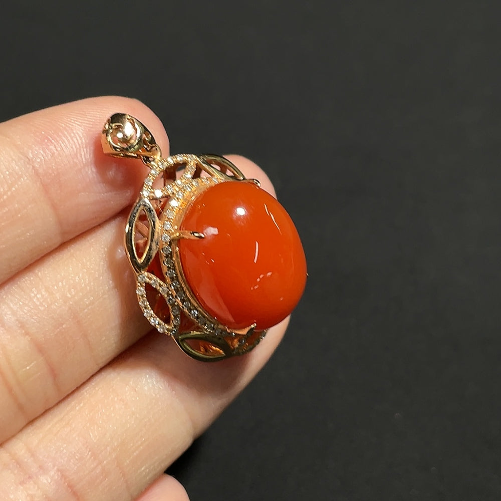 Red agate gemstone pendant with diamond accents in 18K gold, showing organic matter, weight around 5.9g, by HKHQ.