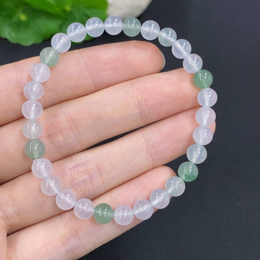 HUILIU HQ jadeite bracelet, approximately 11.4g, with 5.9mm jade beads, showcasing smooth, polished green jade stones.