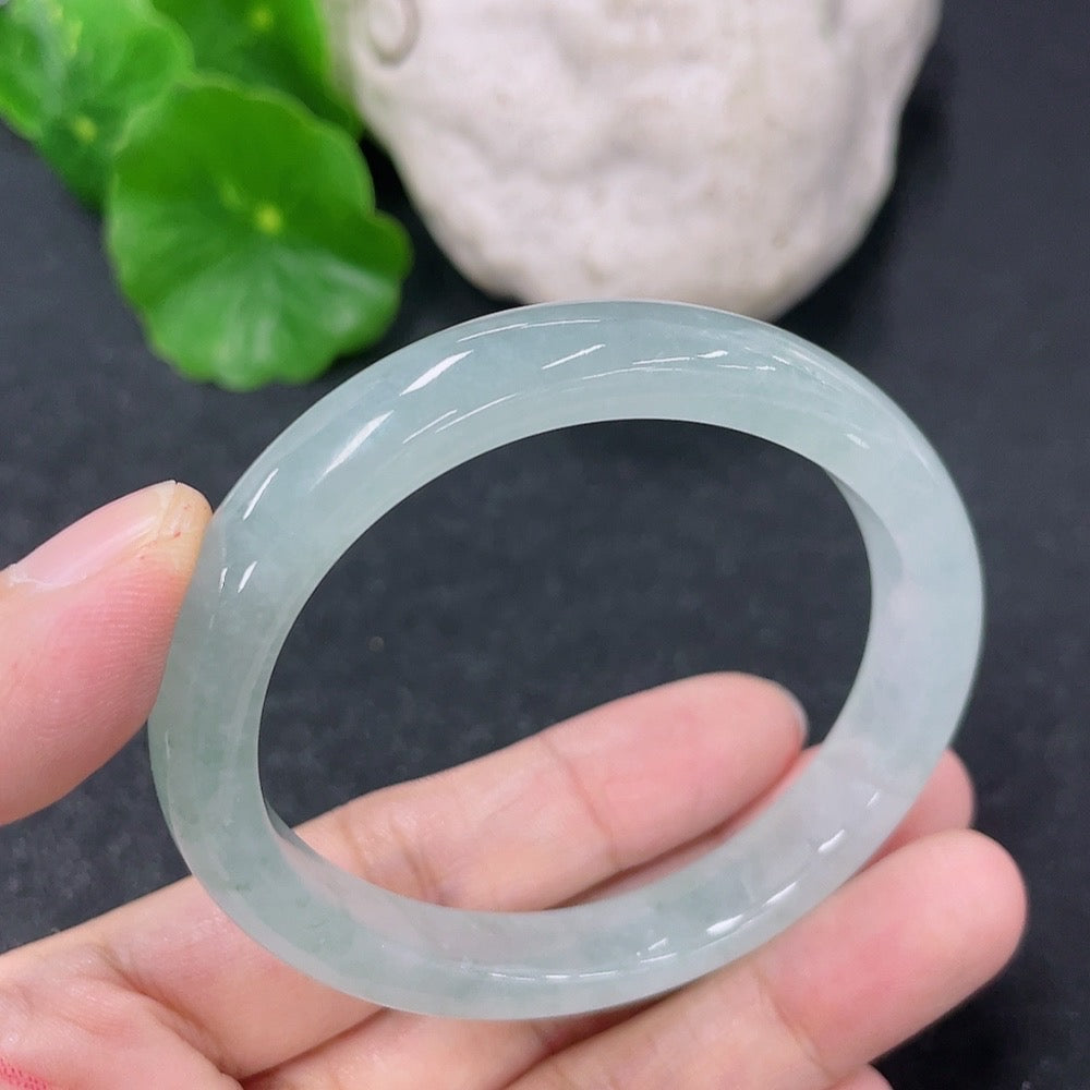 HKHQ jadeite oval bangle in size 52.8 with a 27.69g weight, showcasing smooth, polished jadeite craftsmanship.