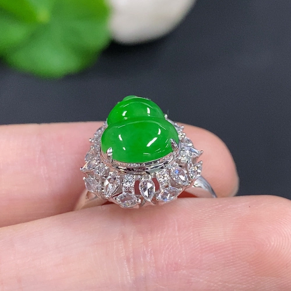 Jadeite gourd inlay ring with 18K gold band and diamond accents, featuring intricate design and luxurious craftsmanship.