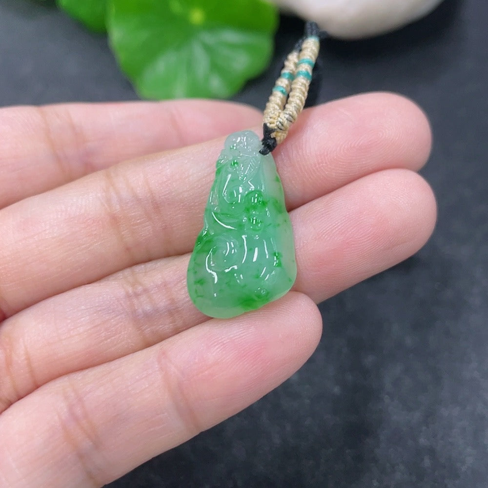 Jadeite pendant Ruyi with rope, crafted from green jade, weighing approximately 4.45g, styled with intricate carvings.