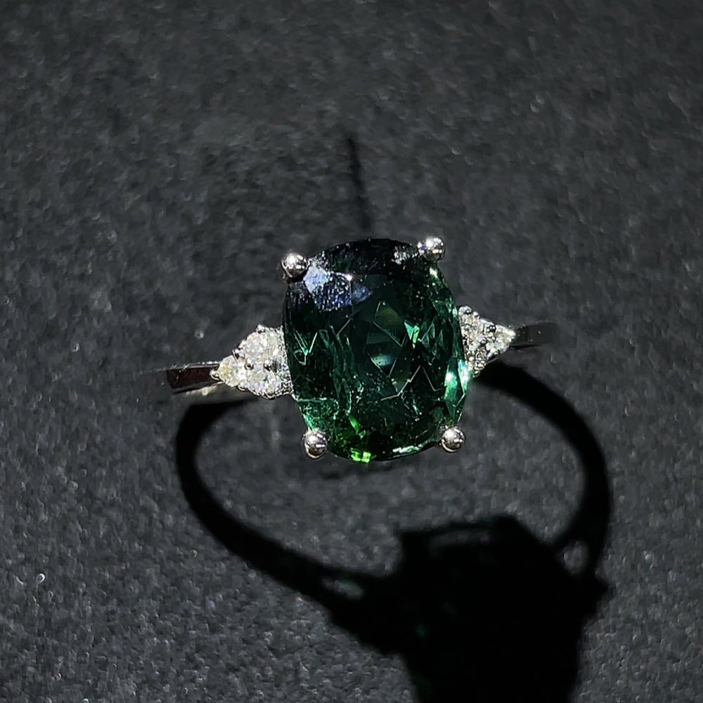 Tourmaline ring with gold setting and diamond accents, featuring a vibrant gemstone and elegant design by HKHQ