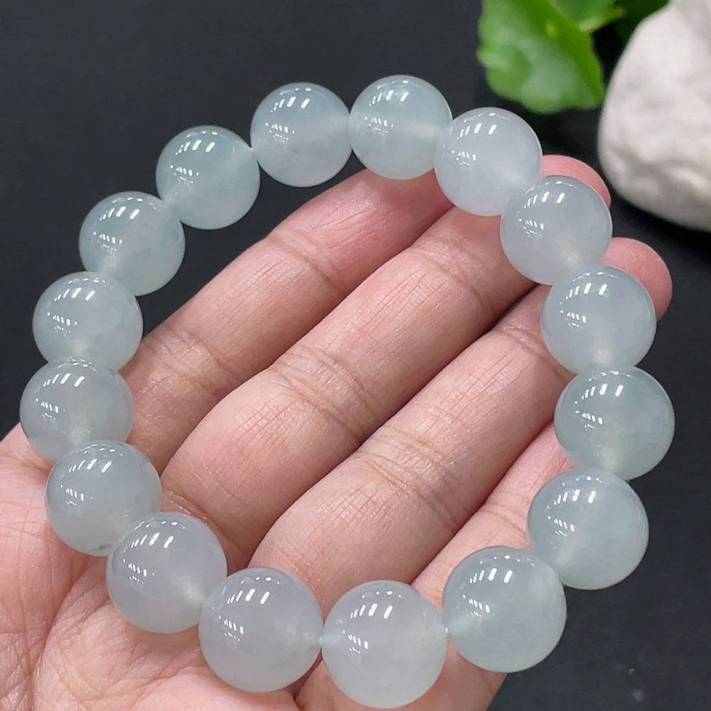 Huiliu Jadeite bracelet with 13mm smooth jade beads, certified by HUILIU HQ, showcasing elegant green jade jewelry.
