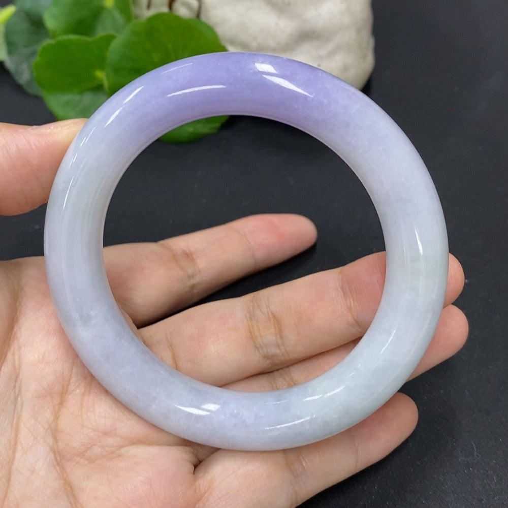 HKHQ jadeite round bangle, size 56.3, weighing 77.3g, showcasing smooth, polished green jadeite bracelet on a white background.