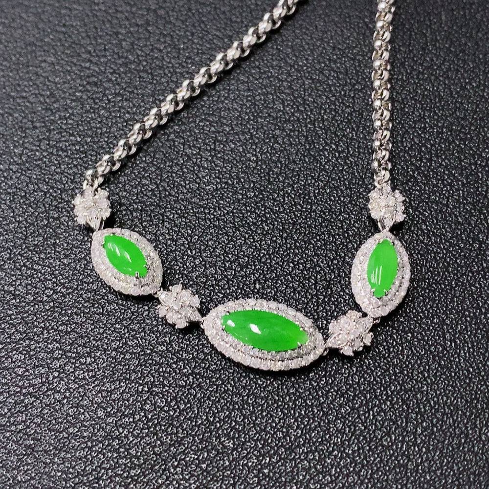 Jadeite jewelry set including necklace, bracelet, earrings, and ring with 18k gold and diamond accents, crafted by HUILIU HQ.