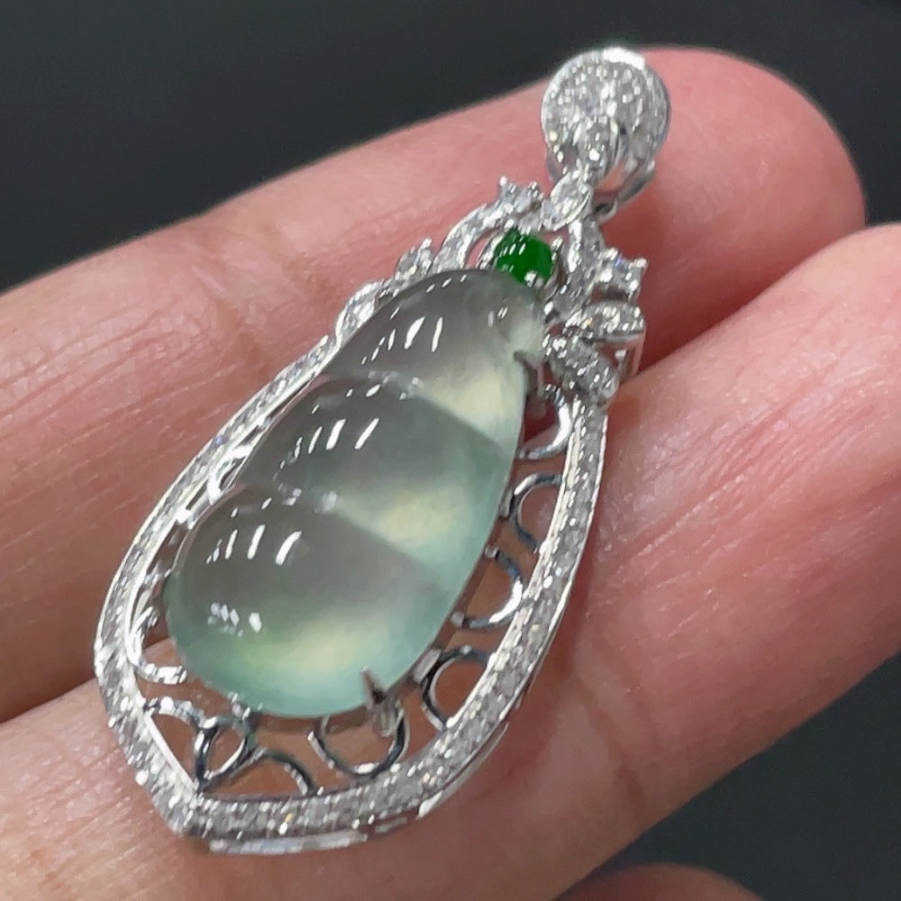 Jadeite blessing bean pendant with 18K gold setting and diamond accents, weight approx. 2.79g, from HUILIU HQ.