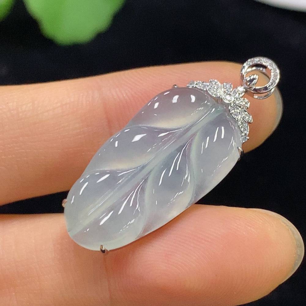 Jadeite leaf inlaid pendant with 18k gold and diamond accents, created by HUILIU HQ, weighing approximately 3.35g.