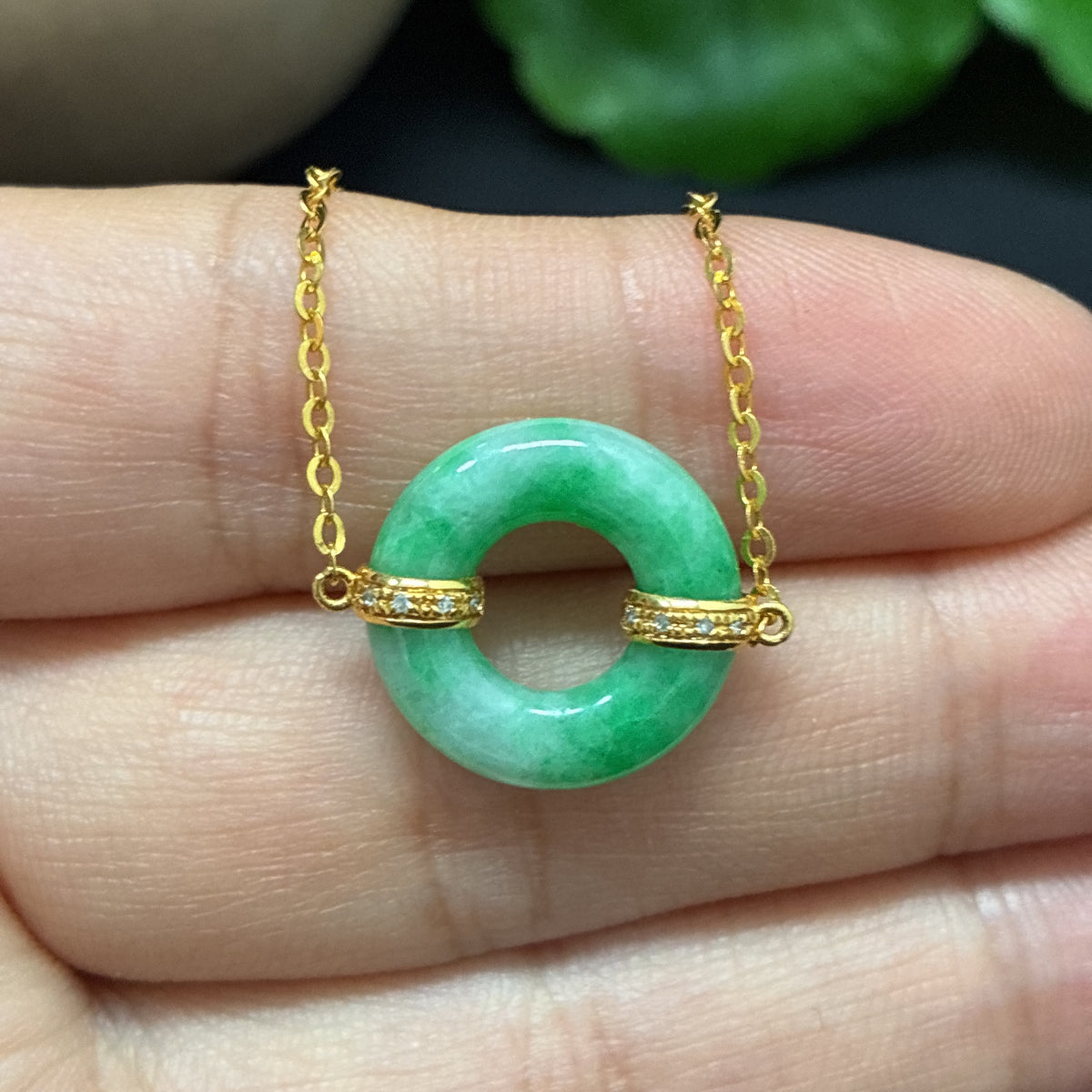 Elegant jadeite inlaid bracelet with diamond accents, 18K gold, crafted by HKHQ, shown with close-up of detailed inlay design.