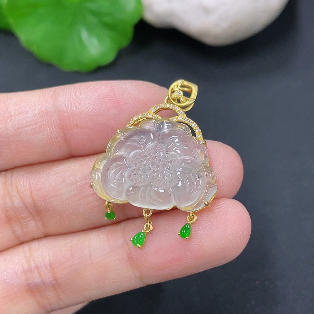 Jadeite inlaid pendant with 18K gold and diamond accents, featuring intricate Jade design, weighing approximately 3.4g.