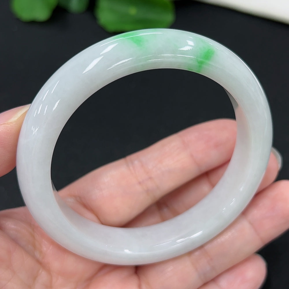 HKHQ Jadeite round bangle, size 57.4, weighing 60.67g, showing its smooth, polished jadeite surface and rounded design.