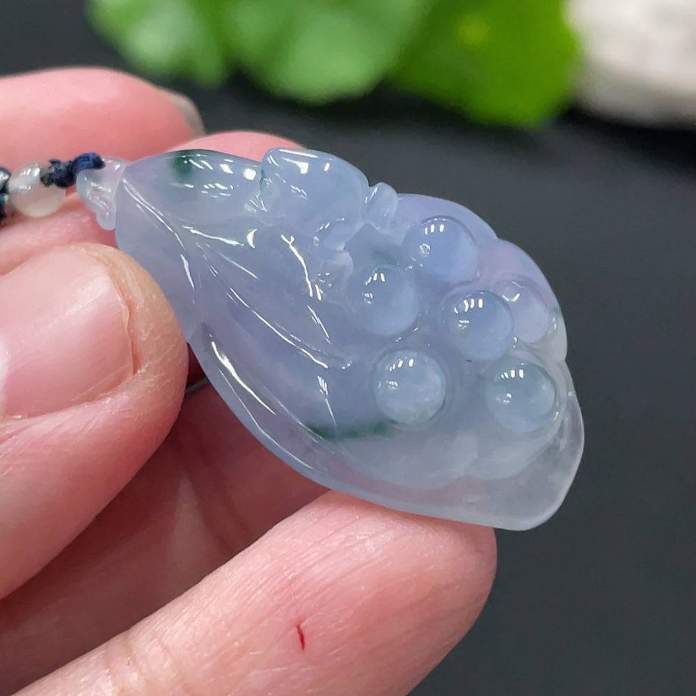 Jadeite Lotus Pod Pendant by HUILIU HQ showing a smooth, green jade pendant shaped like a lotus pod with natural stone details.