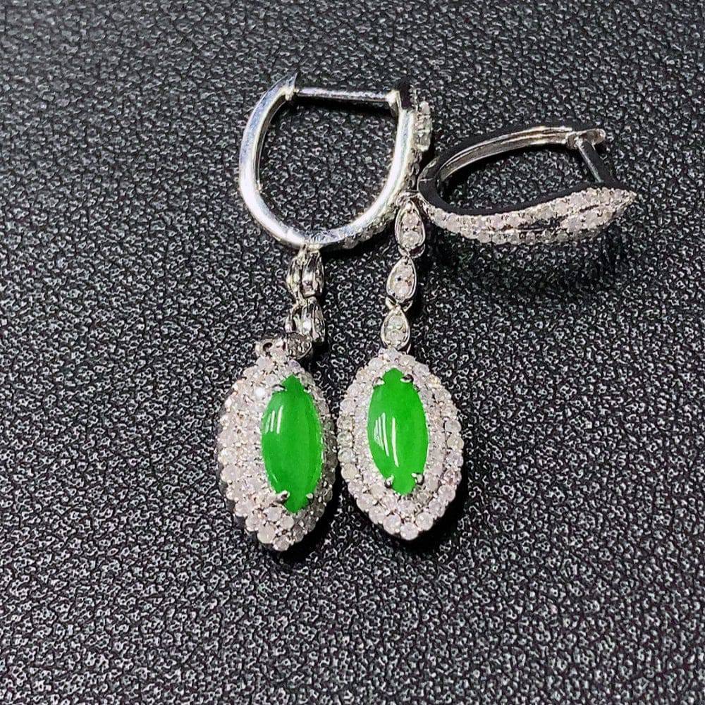 Jadeite inlaid jewelry set with 18k gold, diamond accents including necklace, bracelet, earrings, and ring, weighing 23.5g.