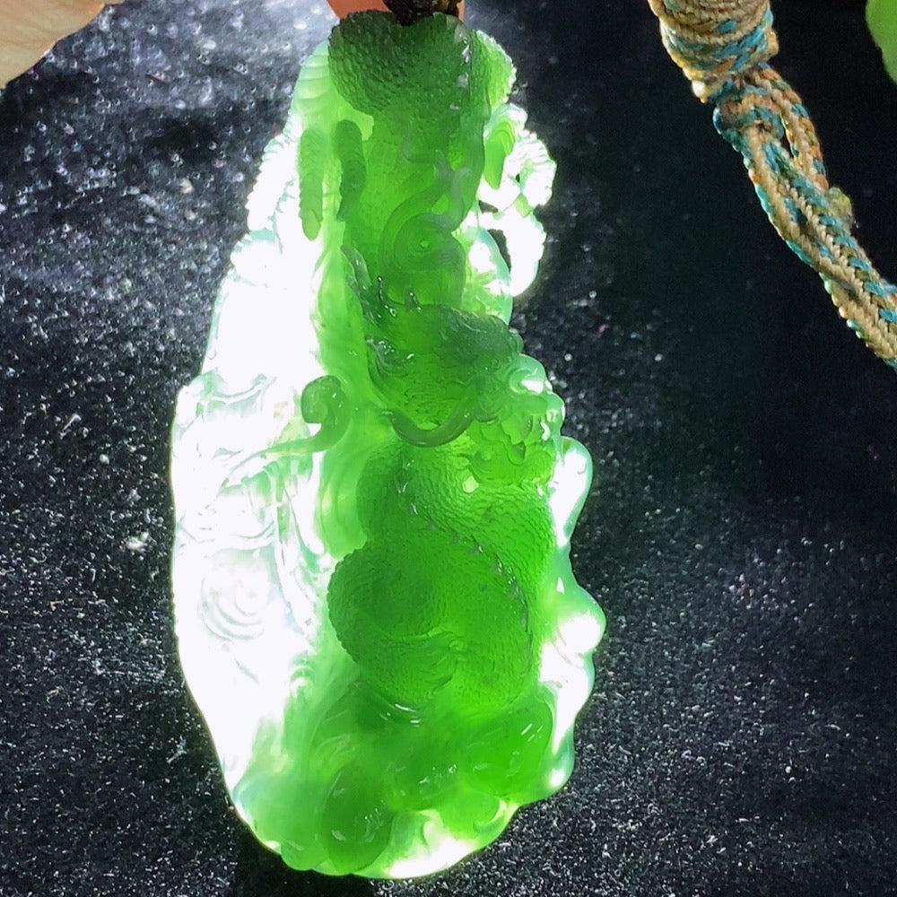 Jadeite pendant featuring a carved dragon plaque with a rope, weighing approximately 60g, from HUILIU HQ.