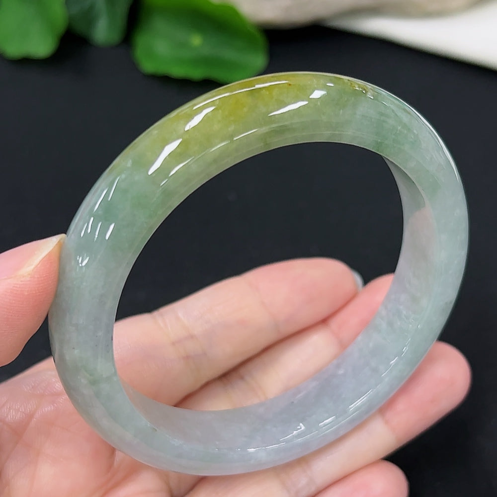 HKHQ jadeite round bangle in size 58, showcasing smooth, polished green jadeite with a sleek, circular design.