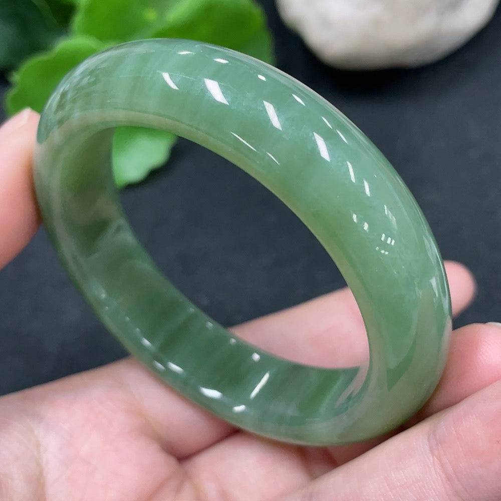 Huiliu certified Hetian jade round bracelet featuring smooth, polished green jade beads on a string.