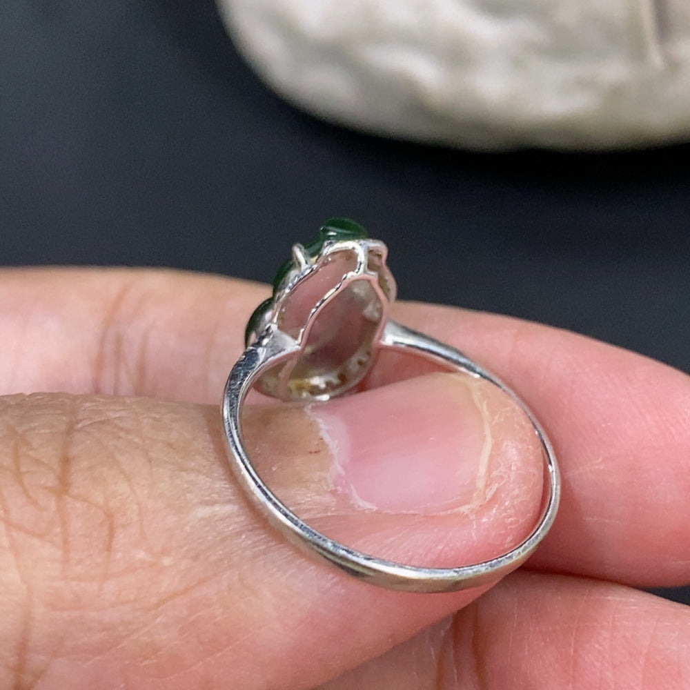 Jadeite gourd inlaid ring with 18K gold and diamond accents, showcasing detailed craftsmanship and elegant design.