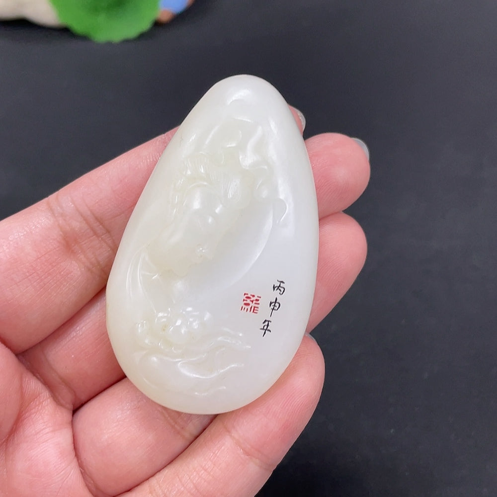 Huiliu certified Hetian Jade Pendant featuring Guanyin figure with undetermined skin color, carved from smooth green jade.
