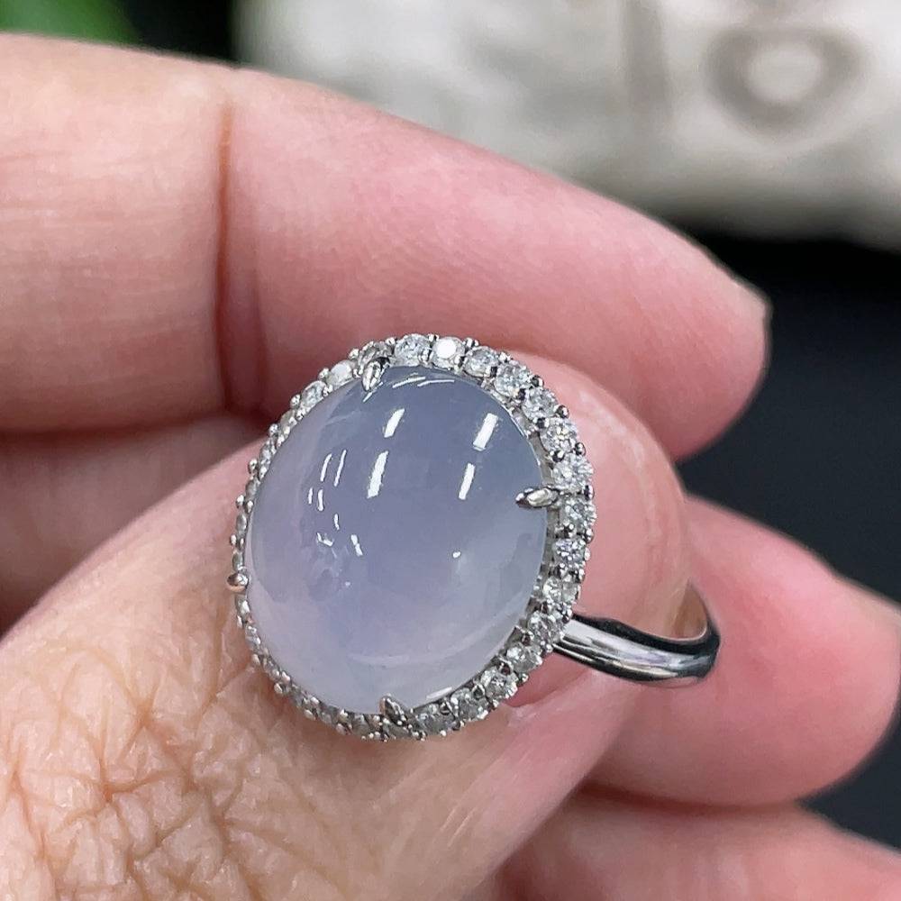 Jadeite cabochon ring with 18k gold band and diamond accents, size 12.5, featuring a smooth green jade gemstone.