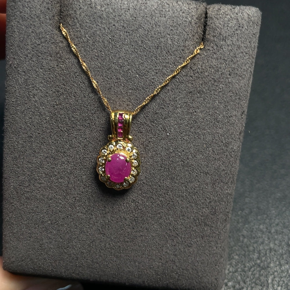 Huiliu Ruby gemstone necklace with diamond accents, featuring a vibrant red ruby pendant on a fine chain.