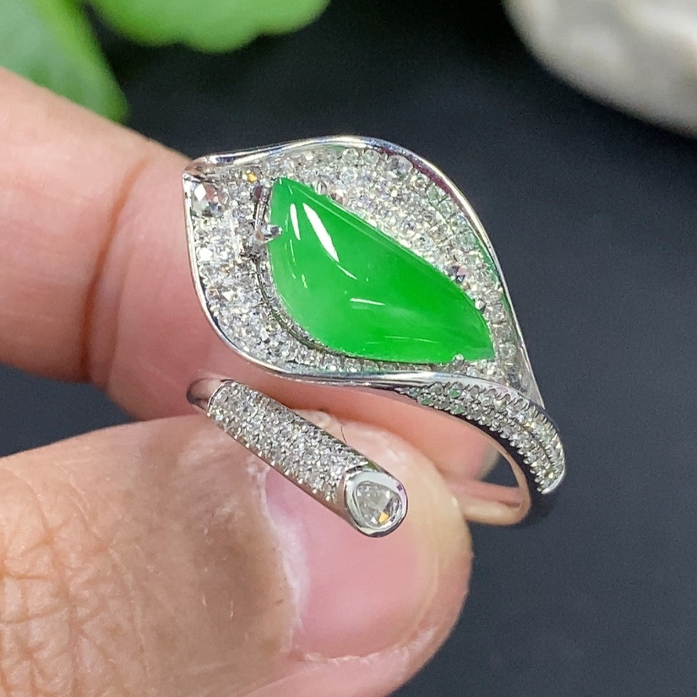 Jadeite freeform inlaid ring with 18K gold band and diamond accent, featuring elegant, organic design and craftsmanship.