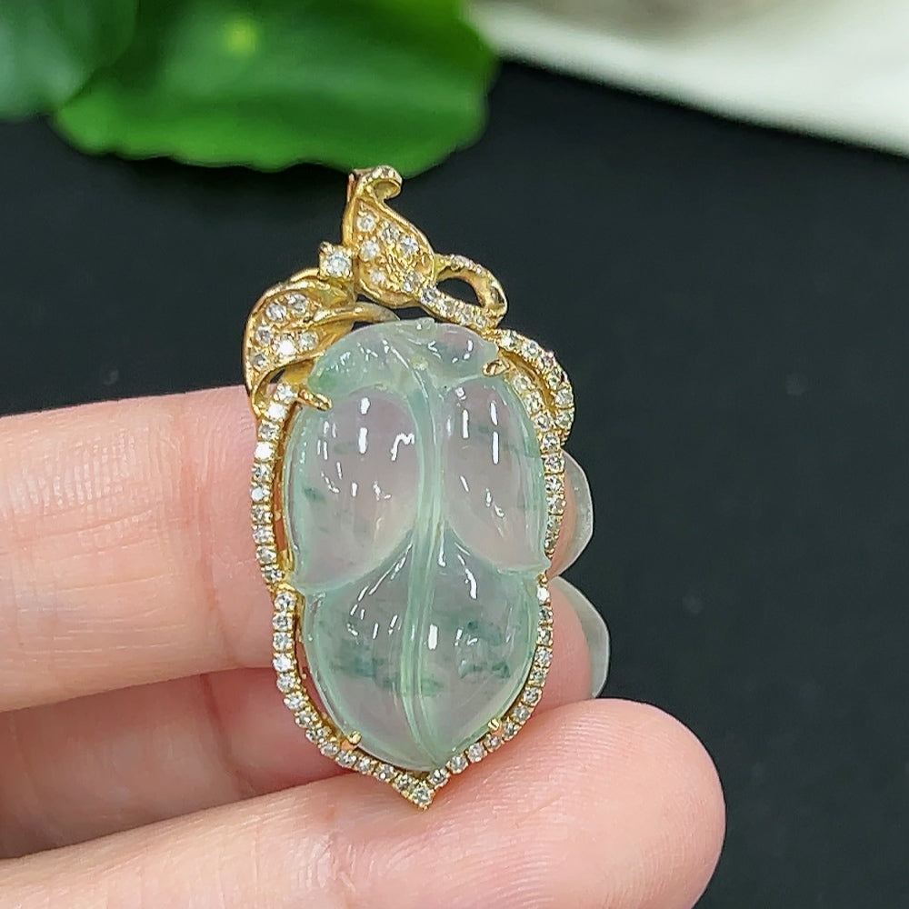 Jadeite leaf inlay pendant with diamond accents, 18K gold from HKHQ, showcasing detailed craftsmanship and natural jade color.