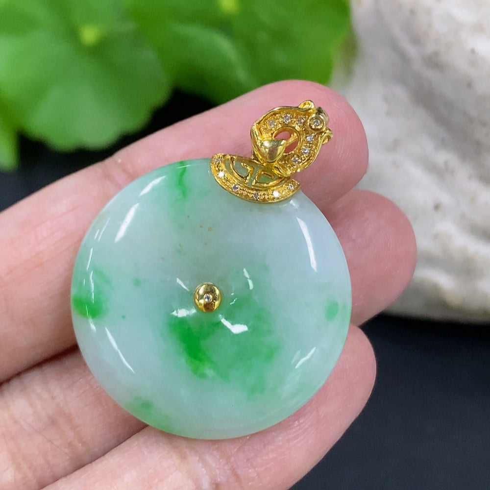 Jadeite Peace Knot pendant with 18K gold clasp and diamond accents, showcasing intricate design and smooth jade surface.