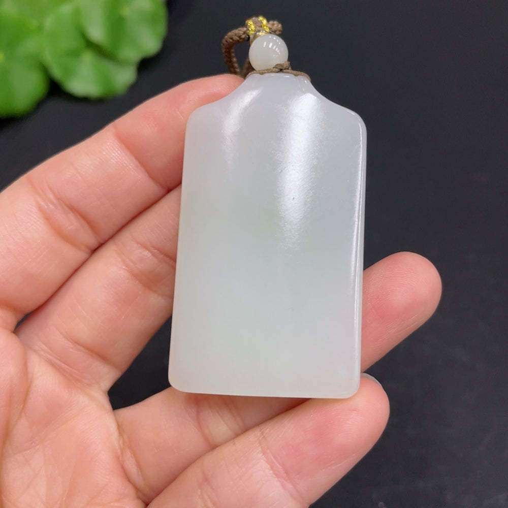 Huiliu certified Hetian jade pendant with plain design, smooth polished surface, showcasing natural jade color and texture.