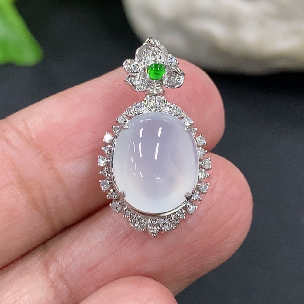 Jadeite cabochon pendant with 18K gold setting and diamond accents, featuring a smooth green jade stone on a delicate chain.