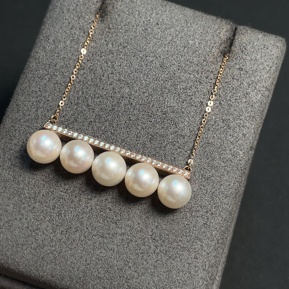 HKHQ seawater pearl necklace with 18k gold chain and 9k gold pendant, featuring a 7.3mm pearl, weighing about 5.18g