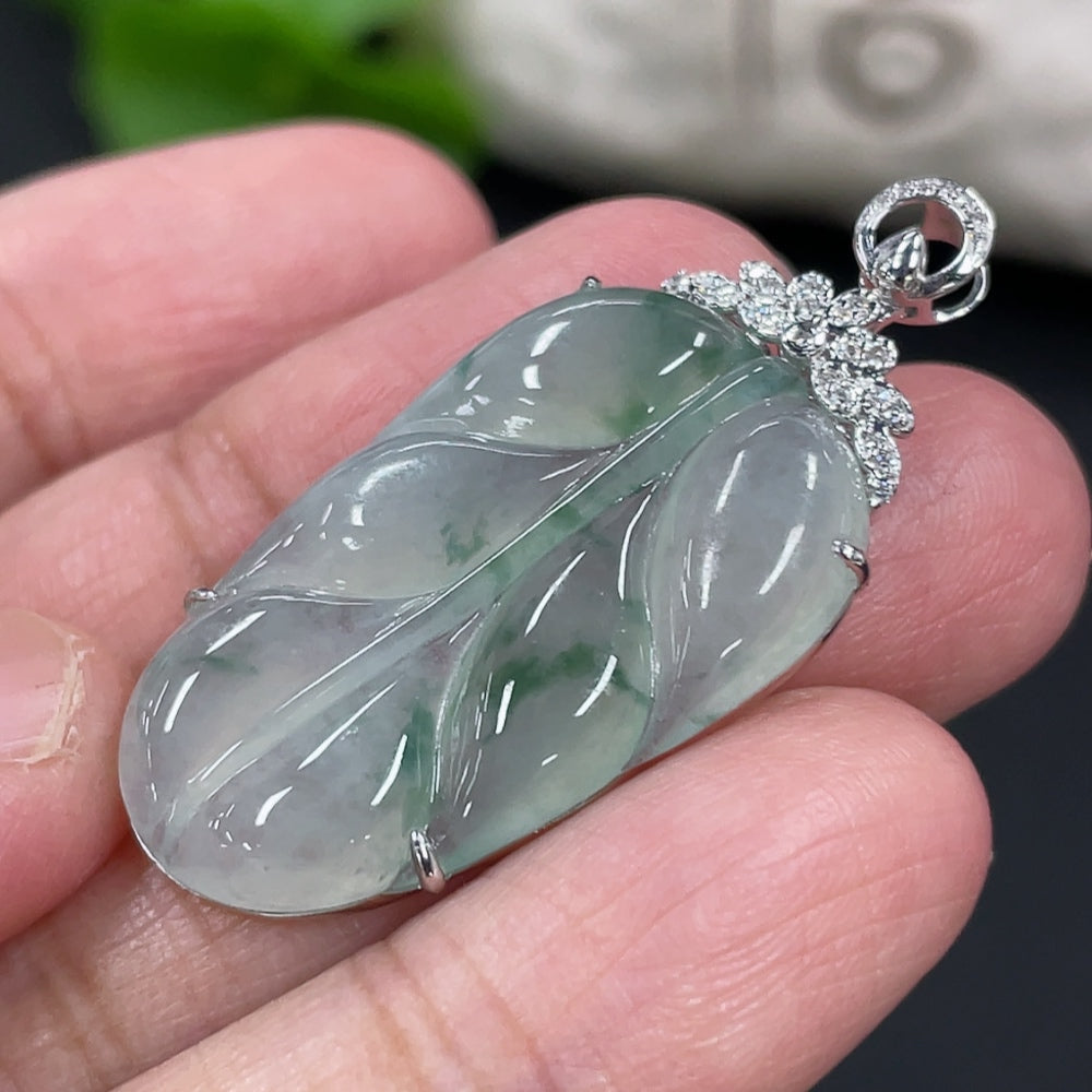 Jadeite leaf pendant in 18K gold setting with diamond accents, weighing approx. 4.6g, from HUILIU HQ.