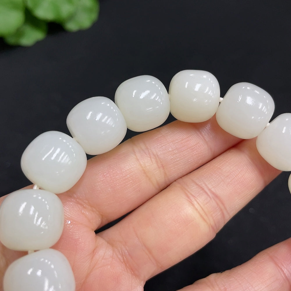 Huiliu certified Hetian jade bracelet with 13.8mm round jade beads, showcasing smooth, polished jade strands.
