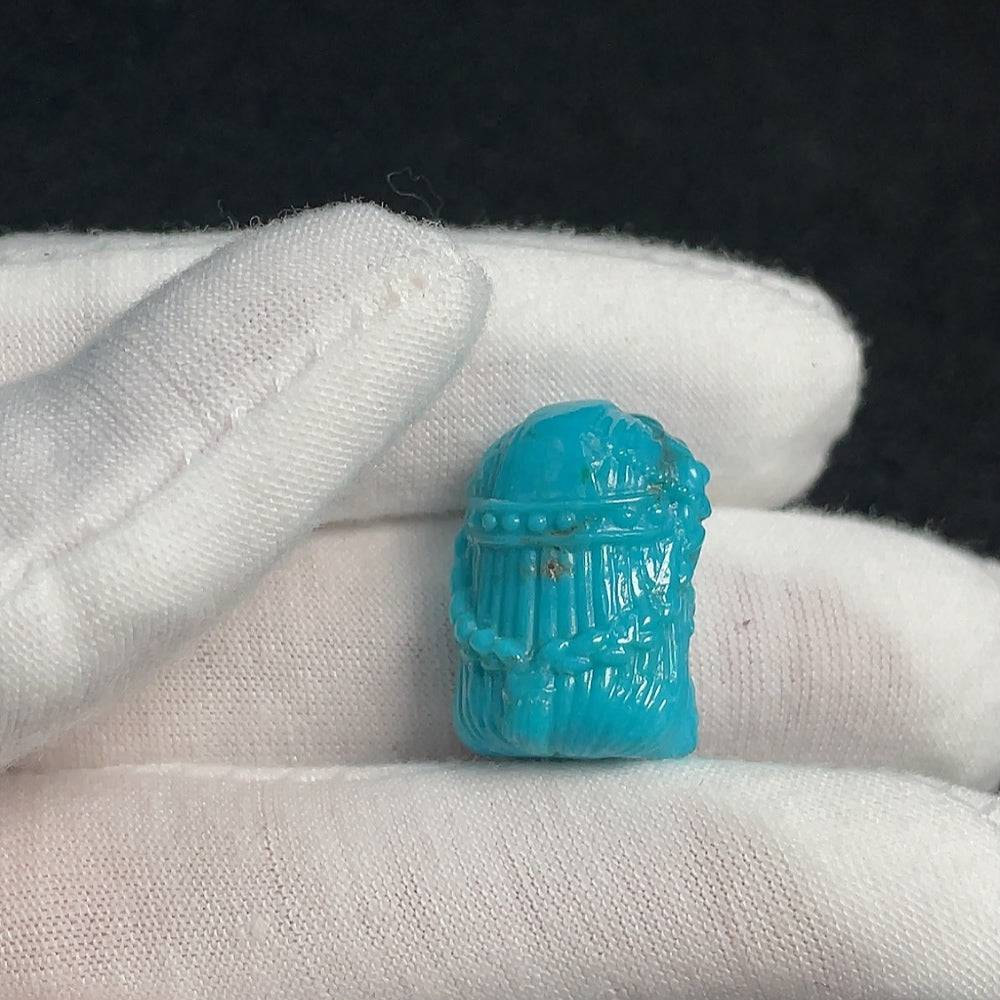 Huiliu turquoise gemstone pendant featuring a vibrant, polished gemstone with natural color variations and a silver setting.