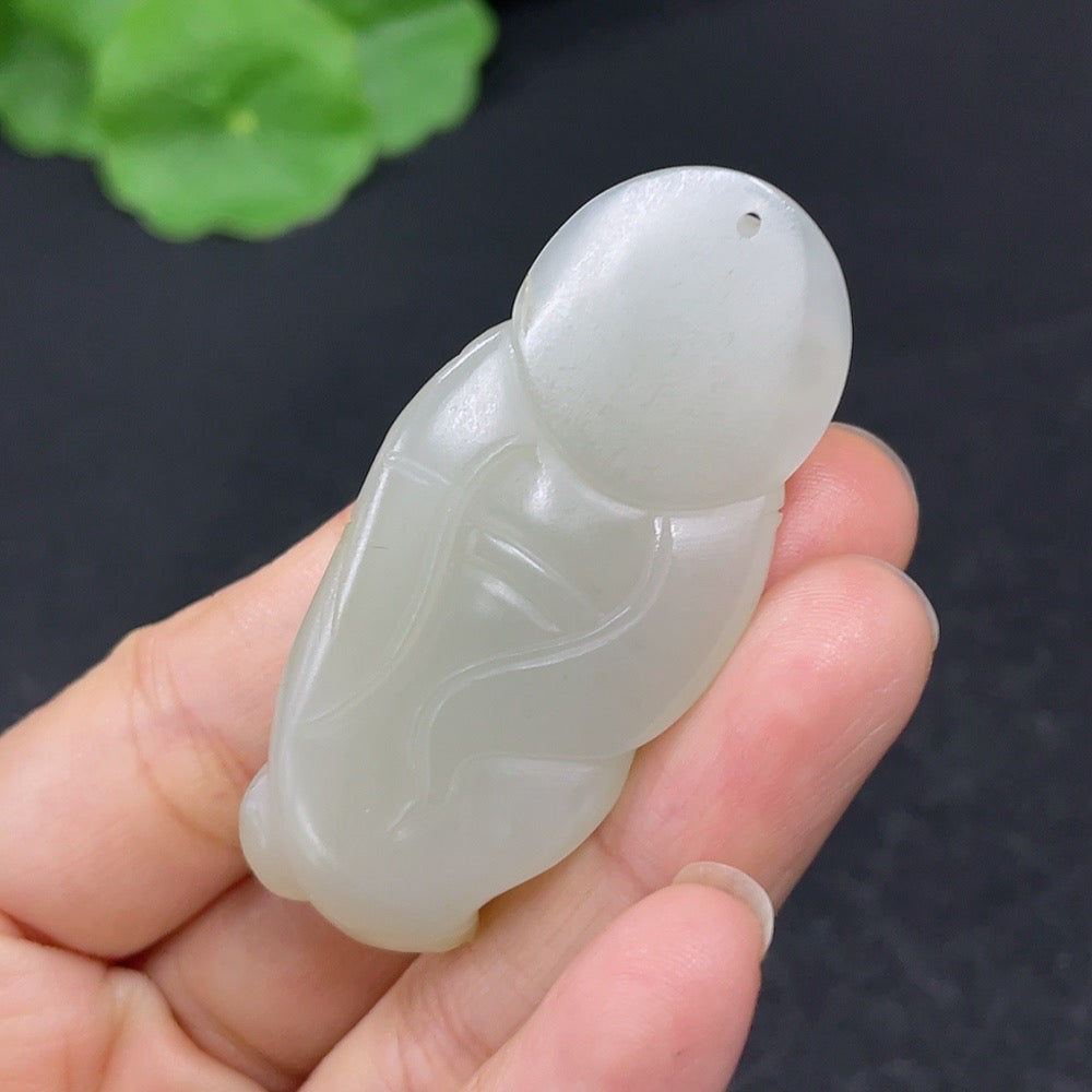 Hetian jade pendant featuring the God of Wealth, weighing about 18.7g, crafted by HKHQ with intricate jade details.
