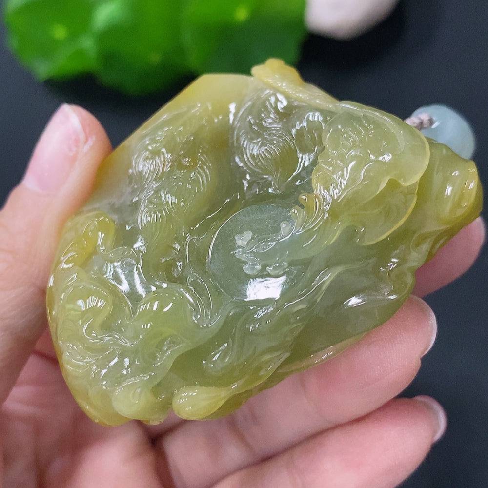 Jadeite pendant featuring a phoenix design from HUILIU HQ, weighing approximately 81g with a rope, in natural jade color.