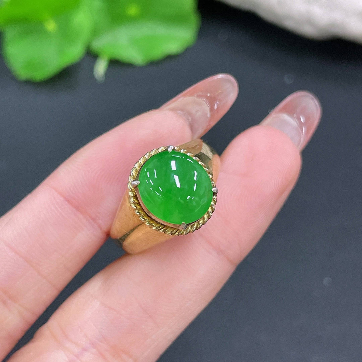 Jadeite cabochon from HUILIU HQ, non-gold, weighing approximately 12.26g, showcasing smooth, polished green jade gemstone.