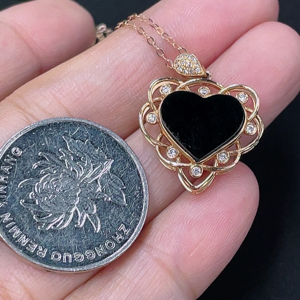 Jadeite heart-shaped pendant with 18k gold and diamond accents