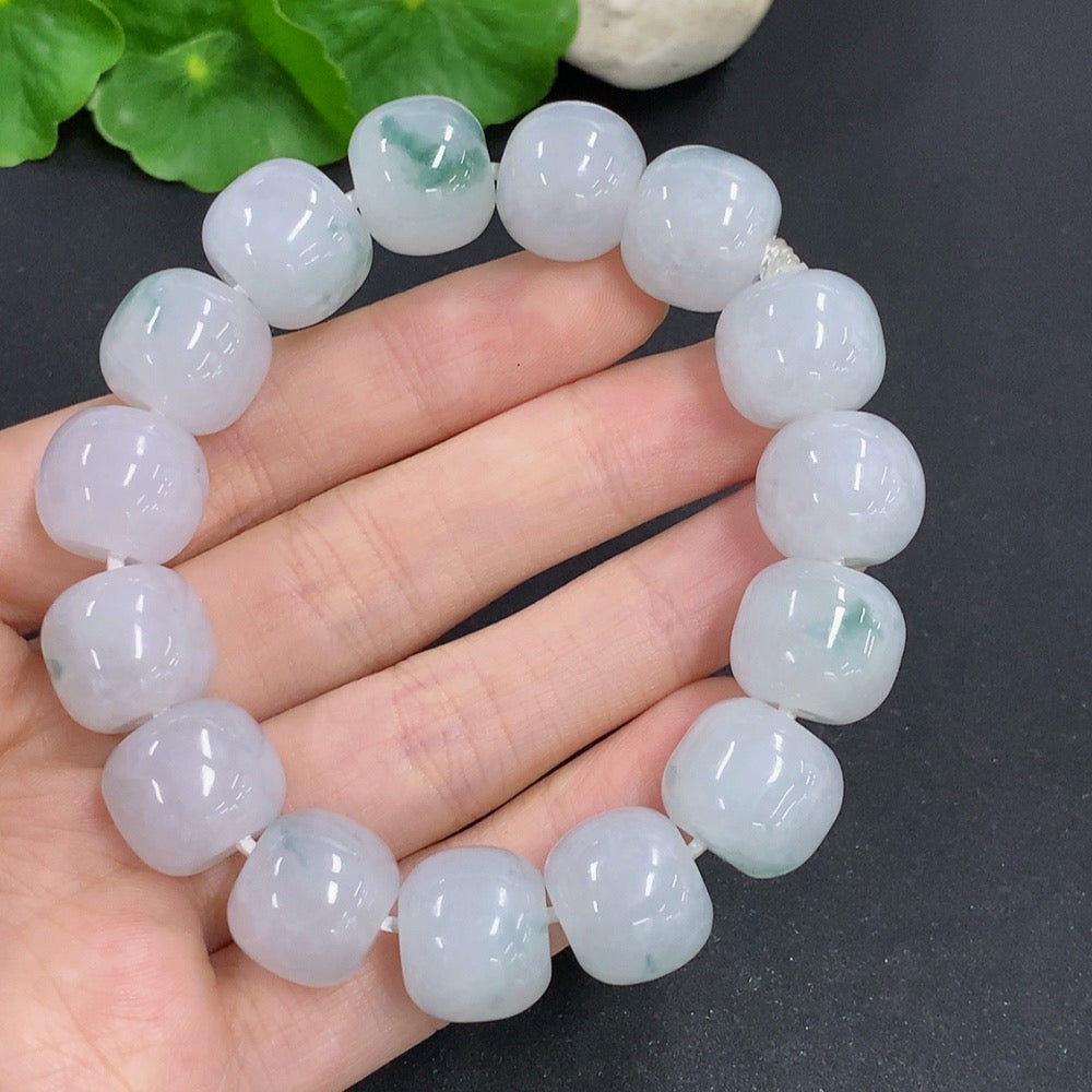 Jadeite bracelet weighing 83.3g with smooth, polished jadeite beads, designed by HKHQ, showcasing elegant craftsmanship.